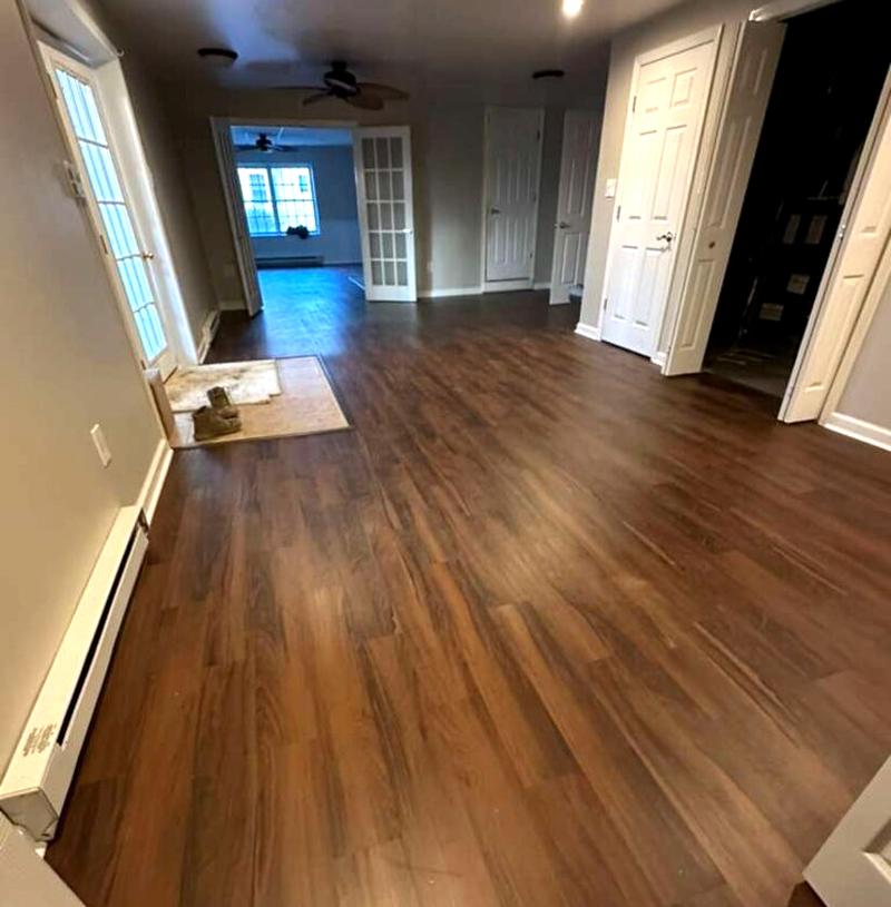 New wood-plank flooring installed through a home by KJ Commercial in Hudson County NJ